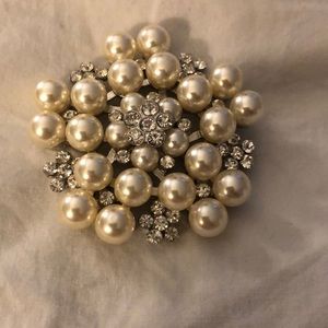 Costume brooch, faux pearl and cubic zirconia.